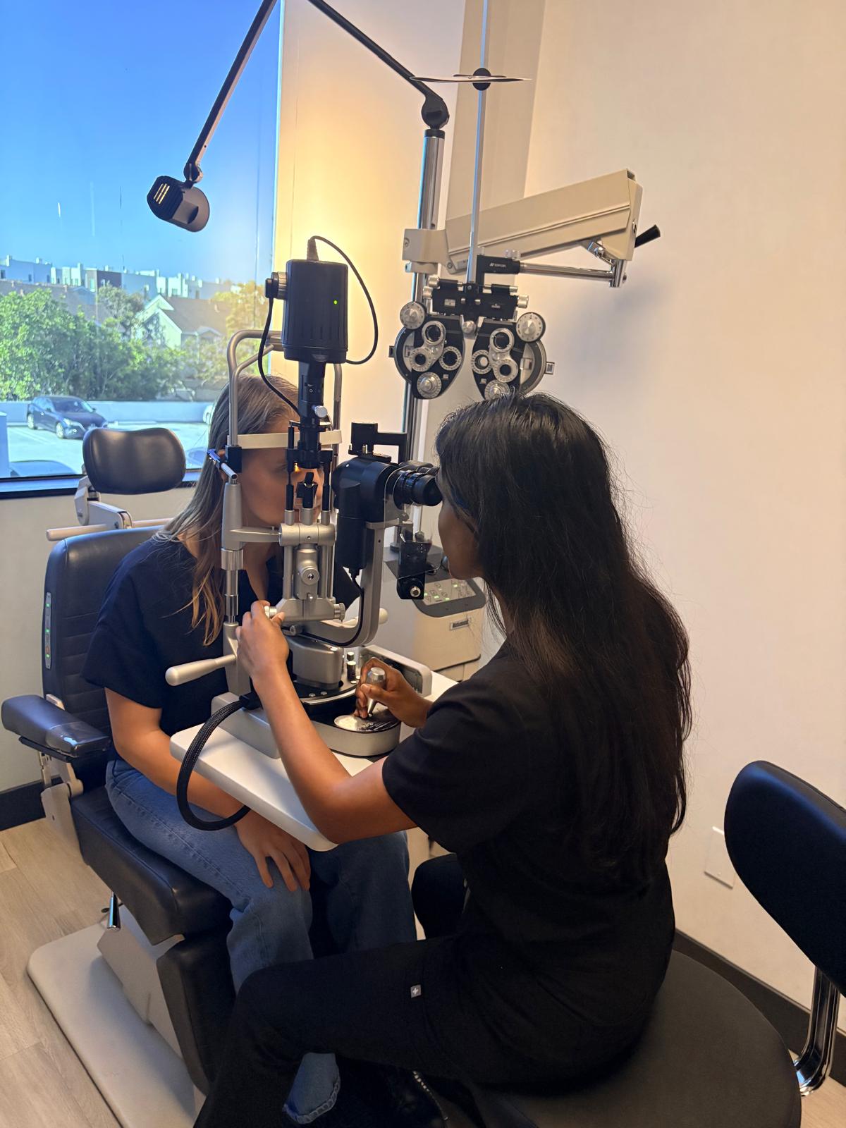 Dr. Abinaya Thenappan performing an eye examination